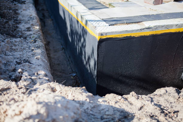 Professional Waterproofing technician working in Muskegon, MI